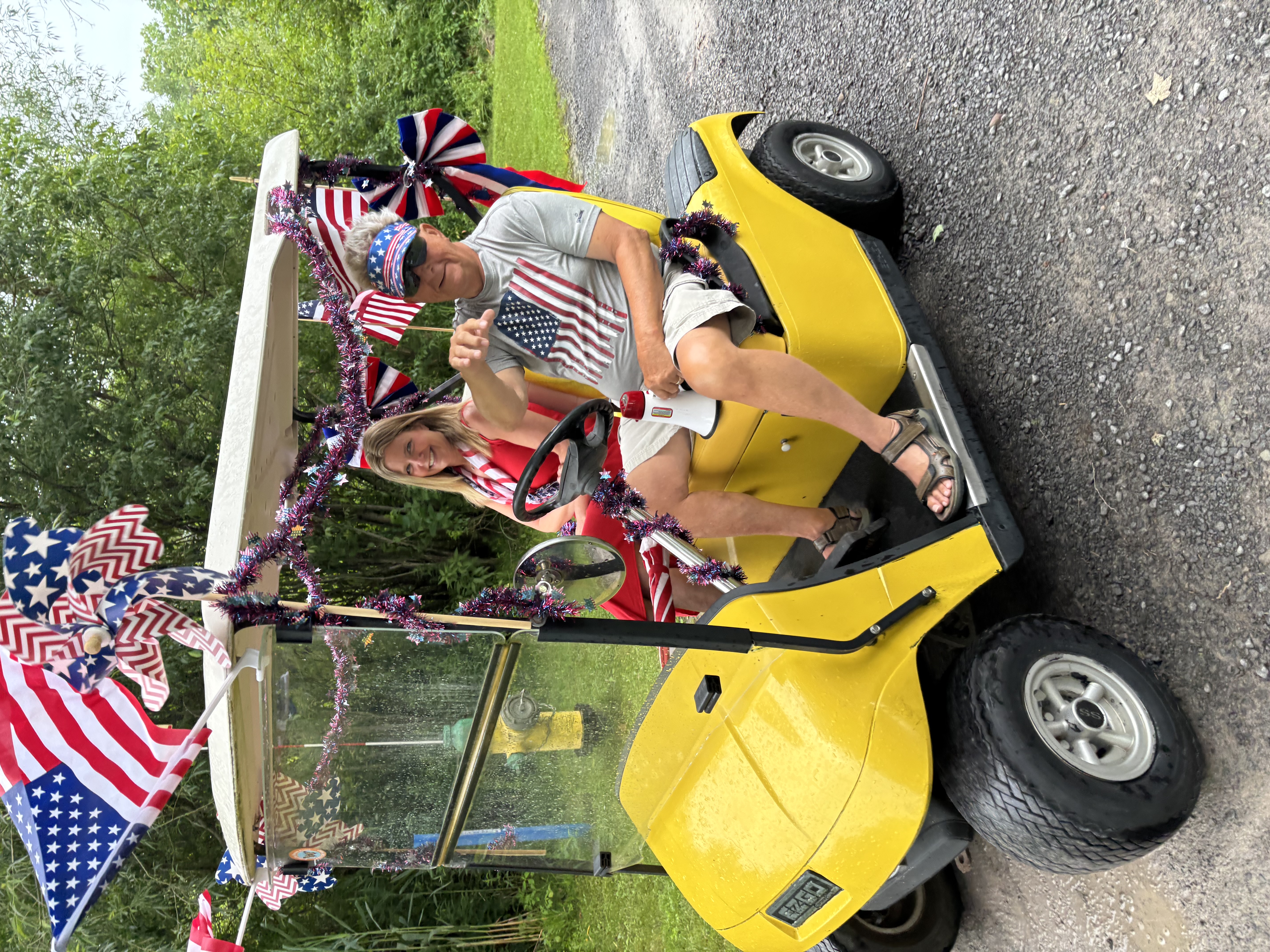 Christine and her dad on the golf cart